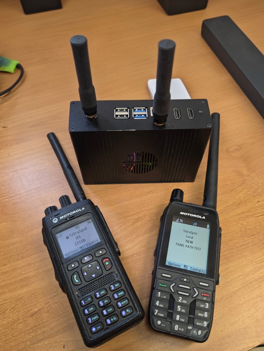 Finished TetraSpot — Raspberry Pi 5 in a case with two antennas and two Motorola radios registered to the network